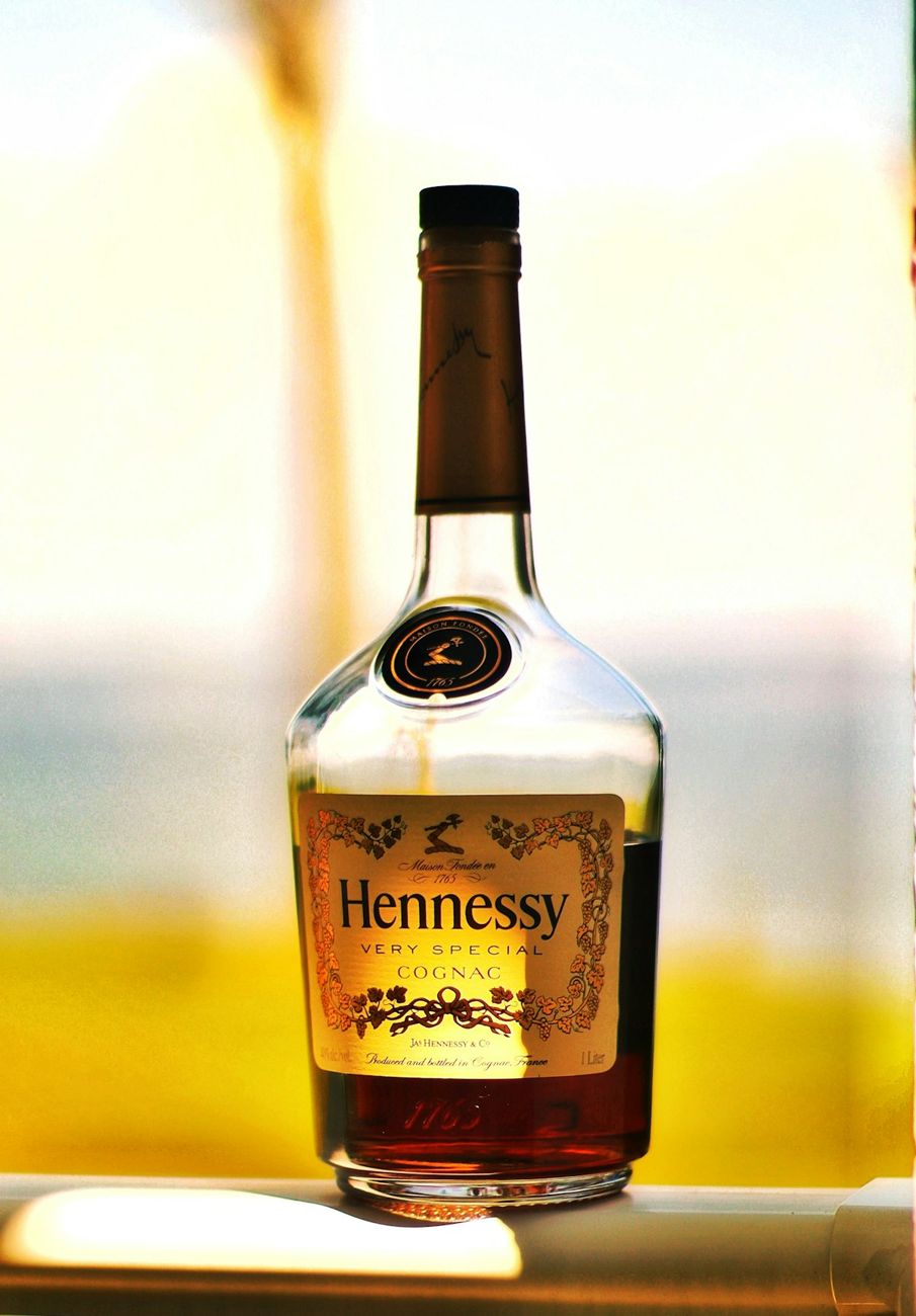 Cognac bottle on a windowsill